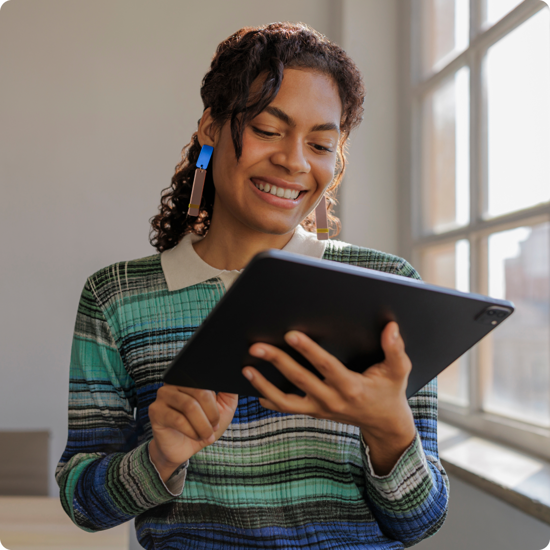 Image of woman smiling and looking down at a book