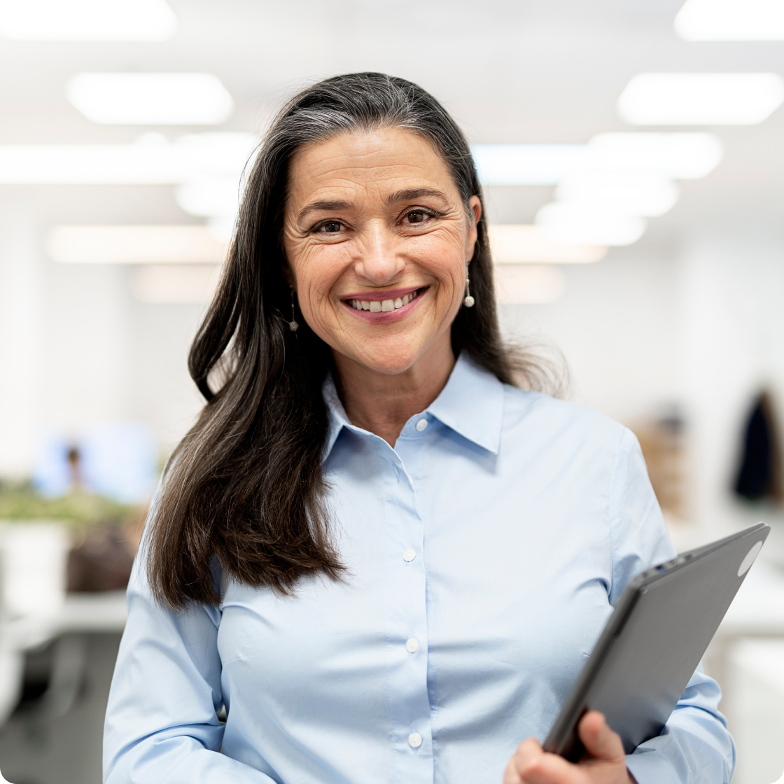Image of woman smiling holding a tablet