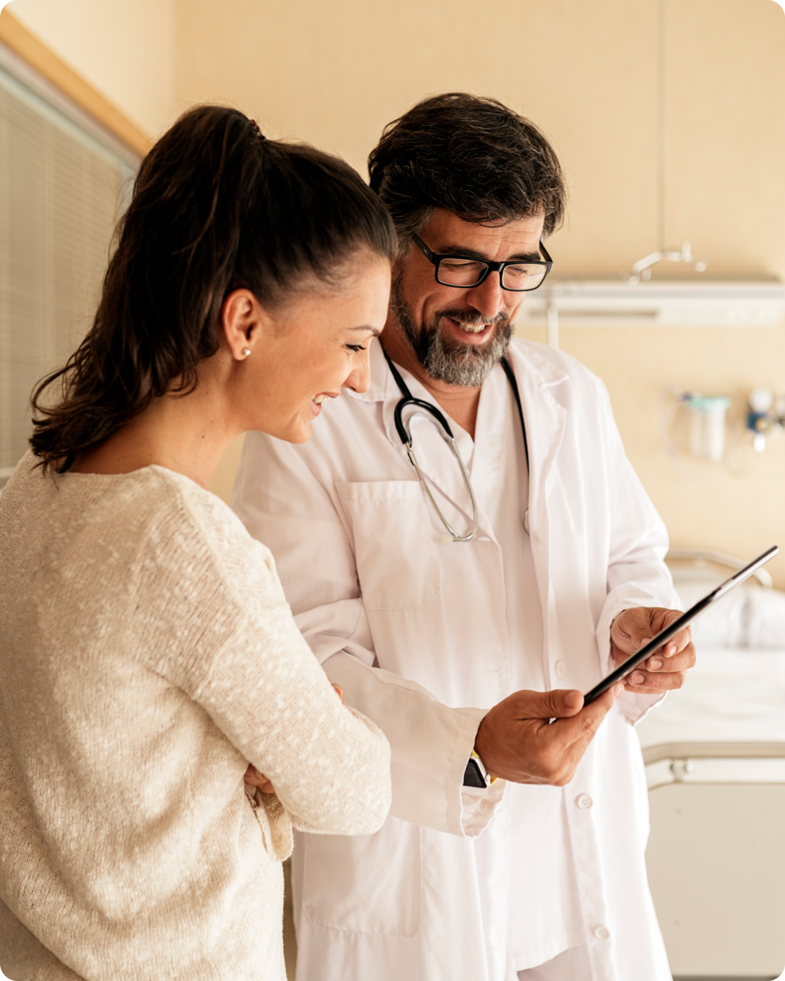 Image of doctor and patient in an office together looking at a chart.