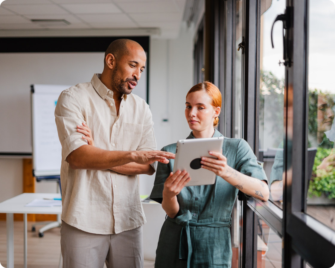 Image of coworkers using a tablet