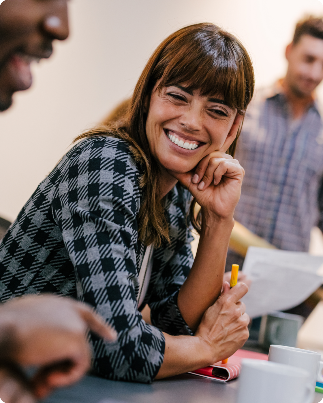 Image of a woman smiling in an office setting